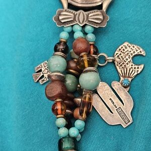 HAND MADE SIGHNED D.LUCAS WATCH BAND,8 inchTOGLE SILVER STAMPED AND TOURQUOISE.